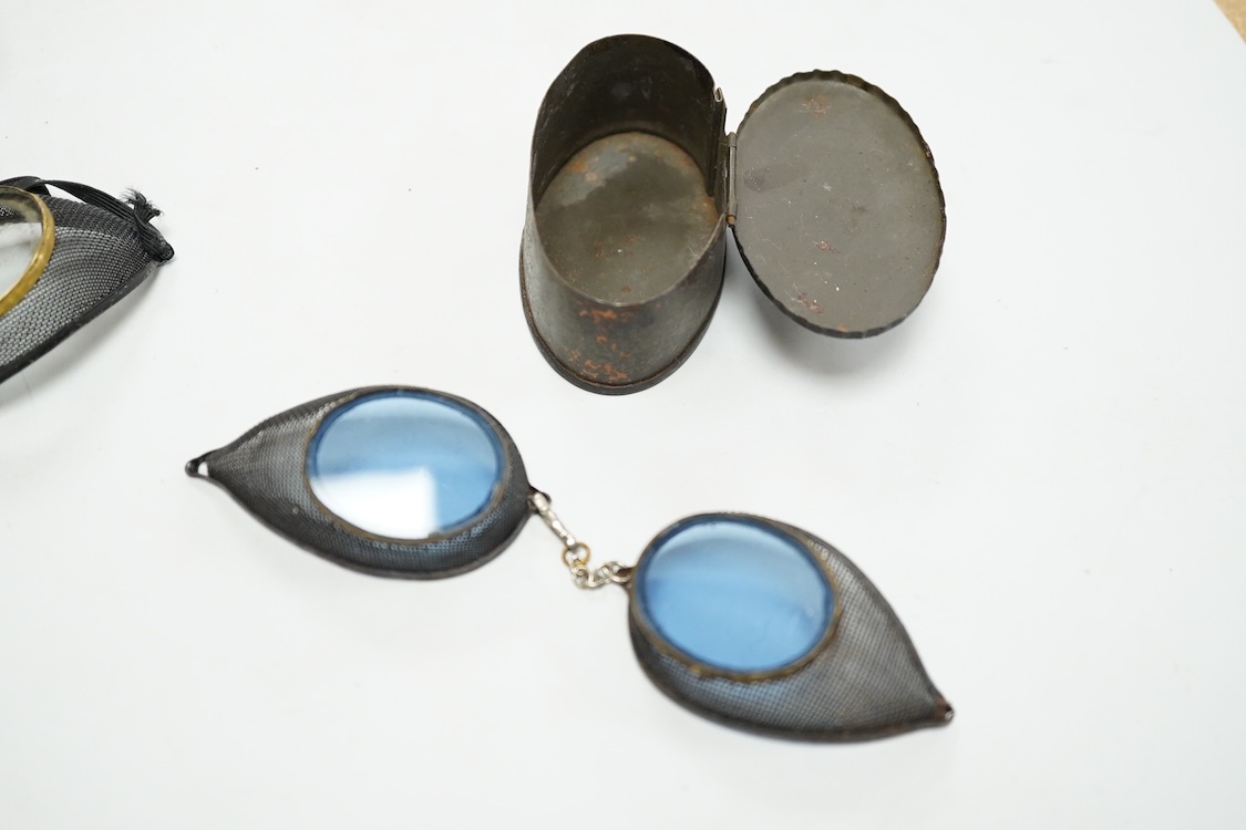 Five pairs of early 20th century goggles with mesh side protectors, two pairs colour tinted, in original tin boxes and two pairs of mesh eye protectors (7)